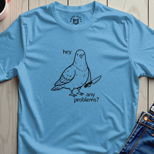 Blue t-shirt with black line drawing of a pigeon holding a knife.