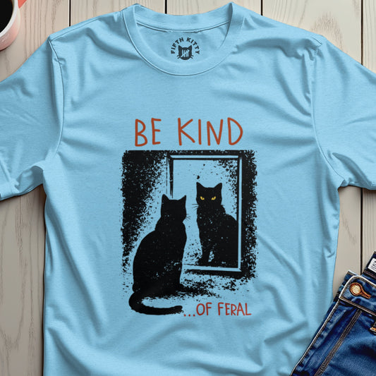 Light blue t-shirt with black cat looking in a mirror, text BE KIND ...OF FERAL.