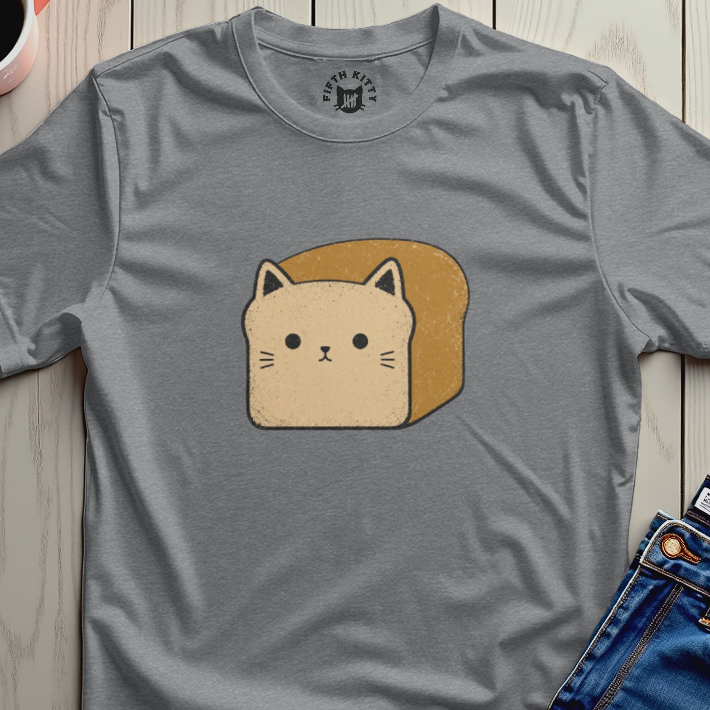 T-shirt with a cartoon cat face integrated into a slice of toast.