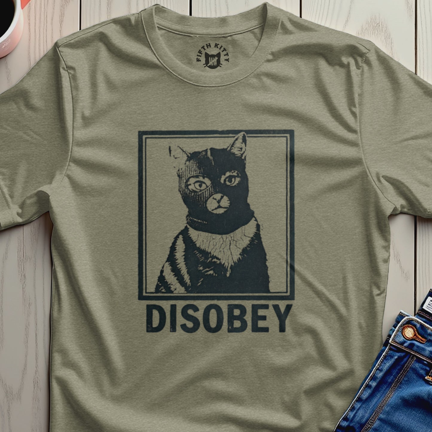 T-shirt with a black cat wearing a ski mask and the word "DISOBEY".