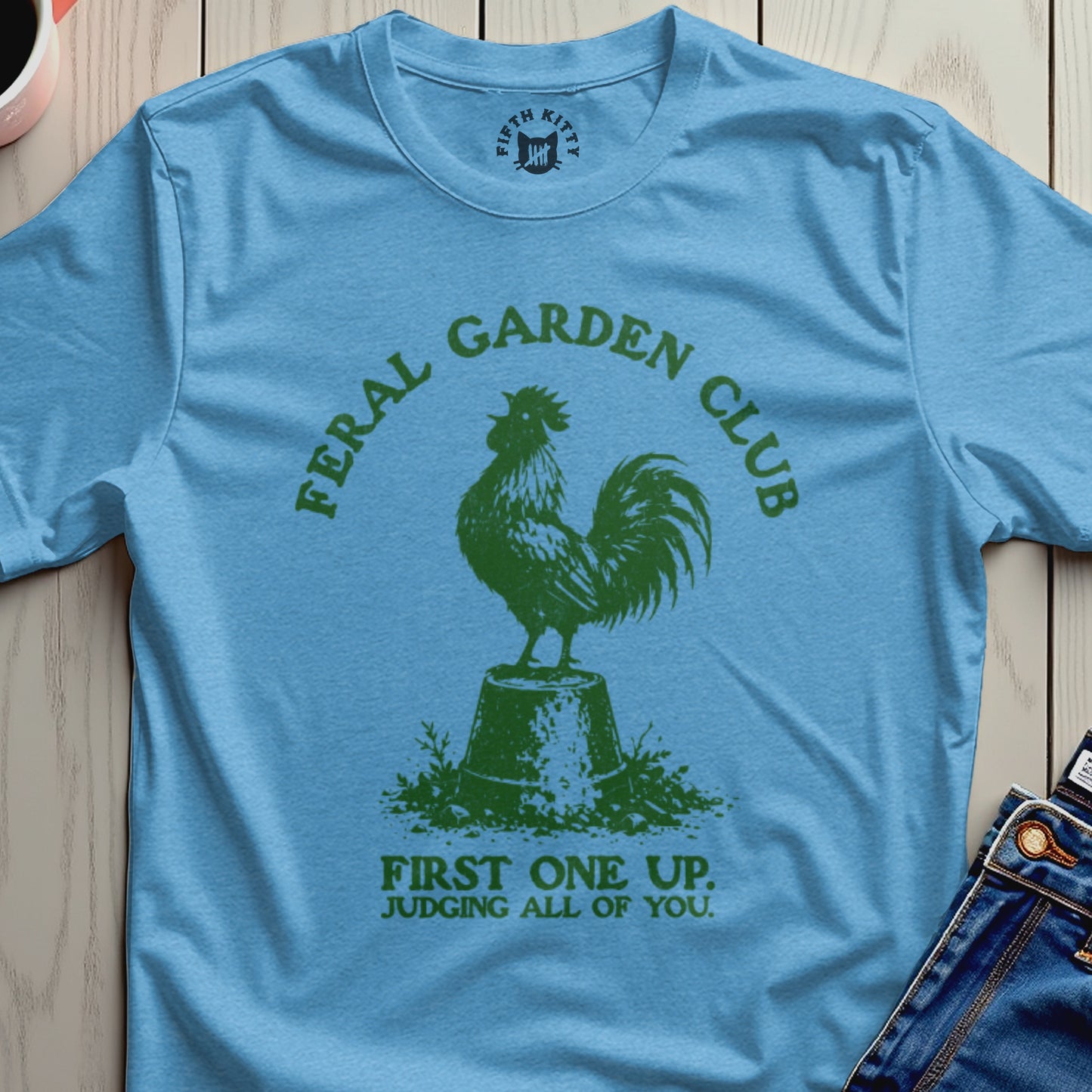 Blue t-shirt with "Feral Garden Club" and a rooster.