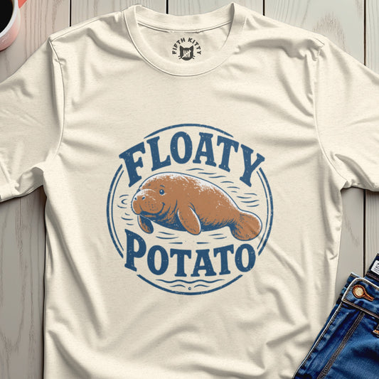 Cream t-shirt with a blue circular graphic of a smiling manatee above the words "FLOATY POTATO."