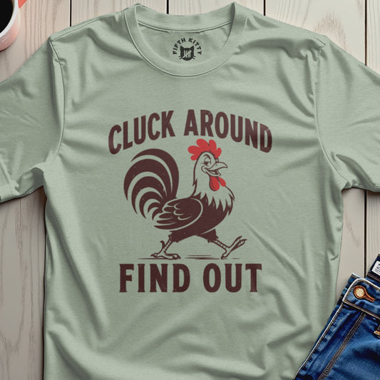 Light green t-shirt with a cartoon rooster and the text "CLUCK AROUND FIND OUT".