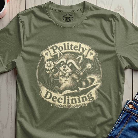 Olive t-shirt with a raccoon holding a daisy and a bomb, text "Politely Declining".