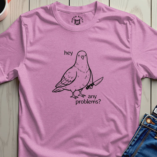 Pink t-shirt with a cartoon pigeon holding a knife and saying "hey any problems?".