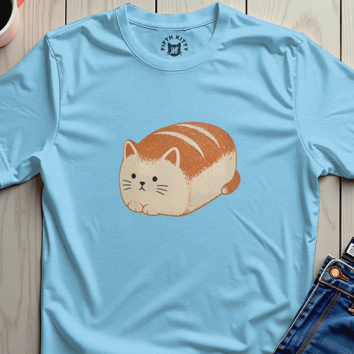 Light blue t-shirt with a loaf-shaped cat illustration and "Fifth Kitty" collar logo.
