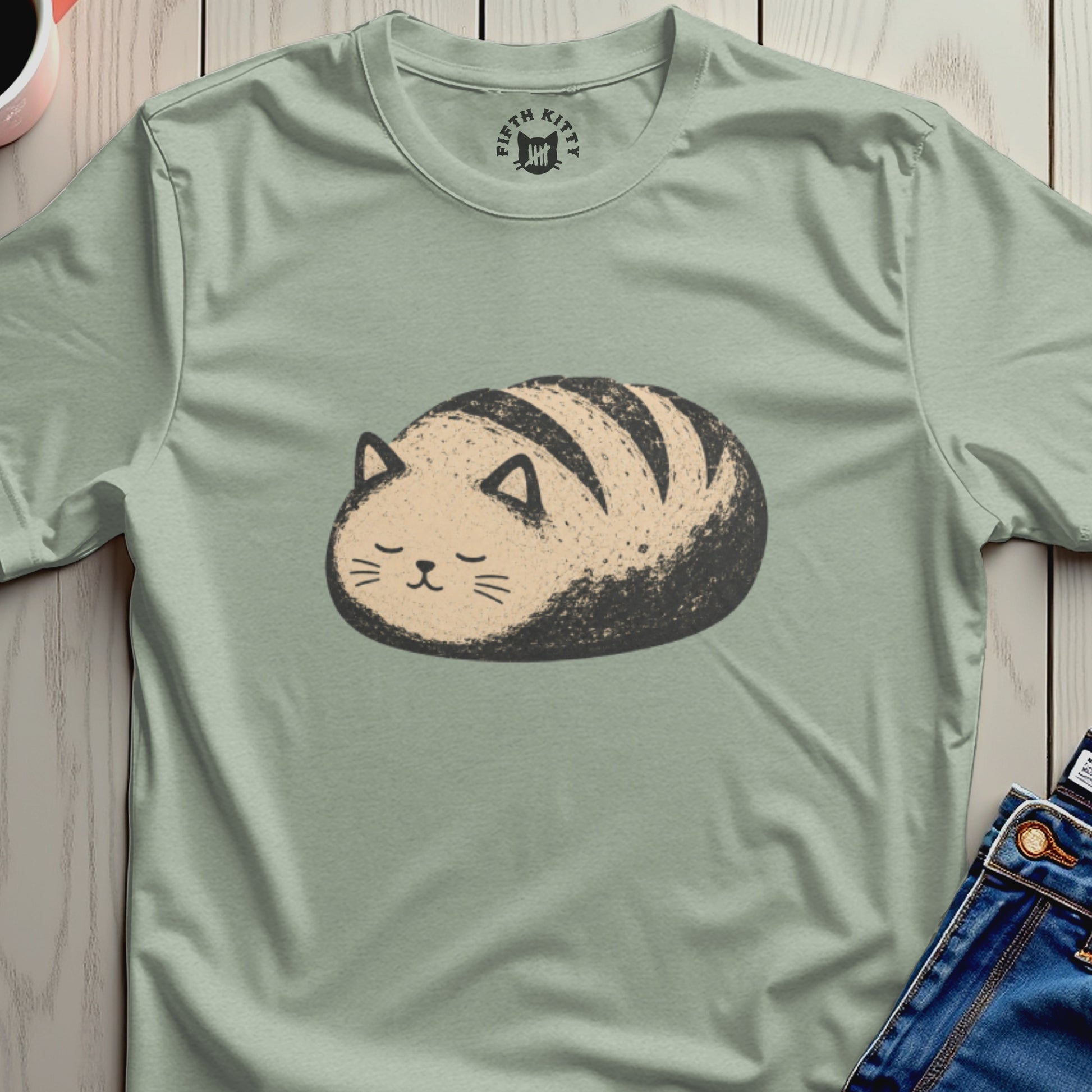 T-shirt with a drawing of a bread-shaped cat with stripes and the "Fifth Kitty" logo.