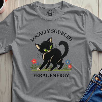 Black cat with green eyes and flowers, "Locally Sourced Feral Energy" text.