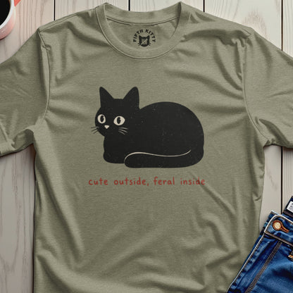 T-shirt with black cat illustration and text "cute outside, feral inside".