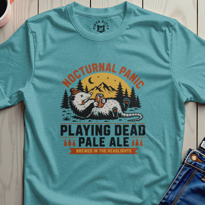 Opossum holding beer can with text "Nocturnal Panic Pale Ale".