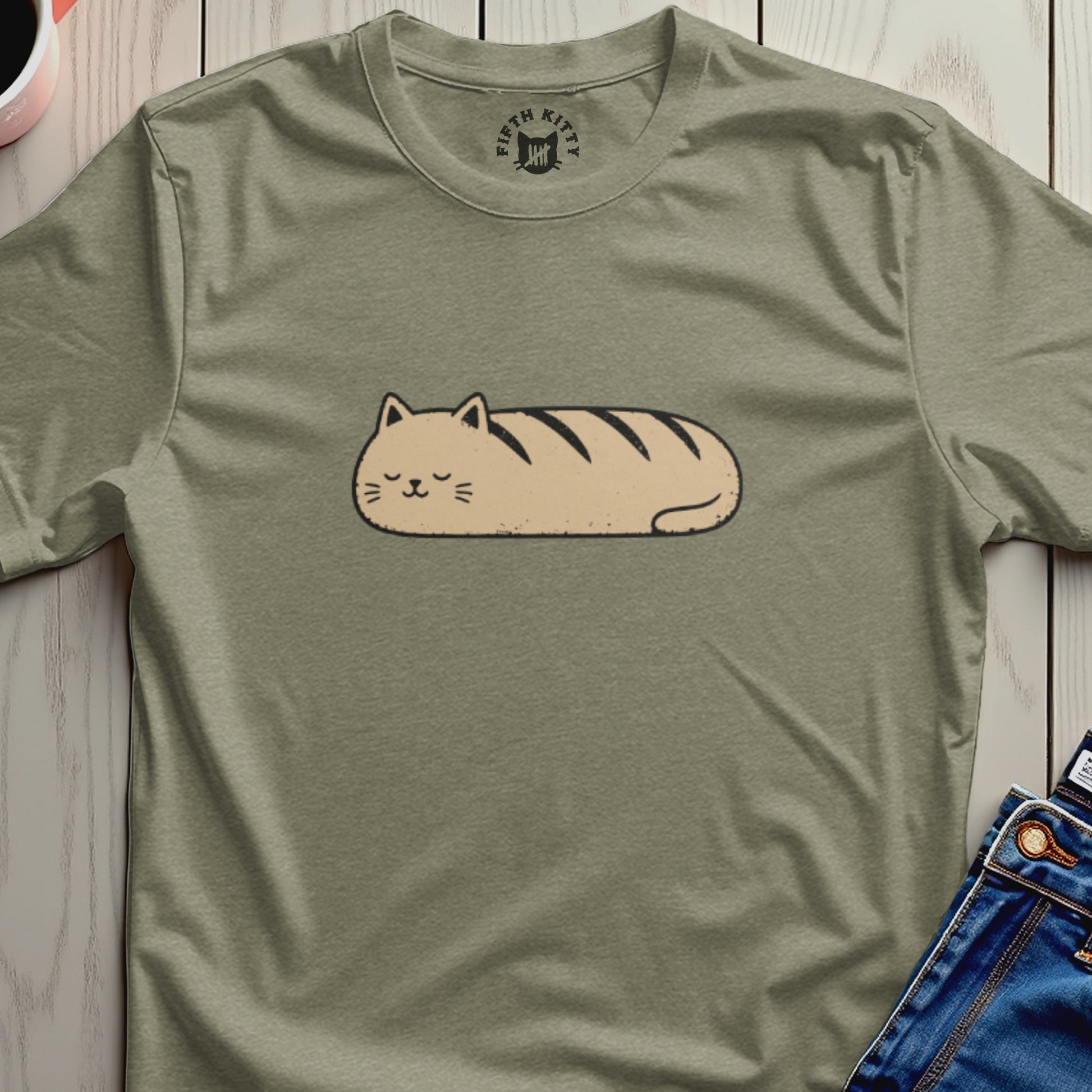 Green t-shirt with a caricature of a loaf-shaped cat printed on it.