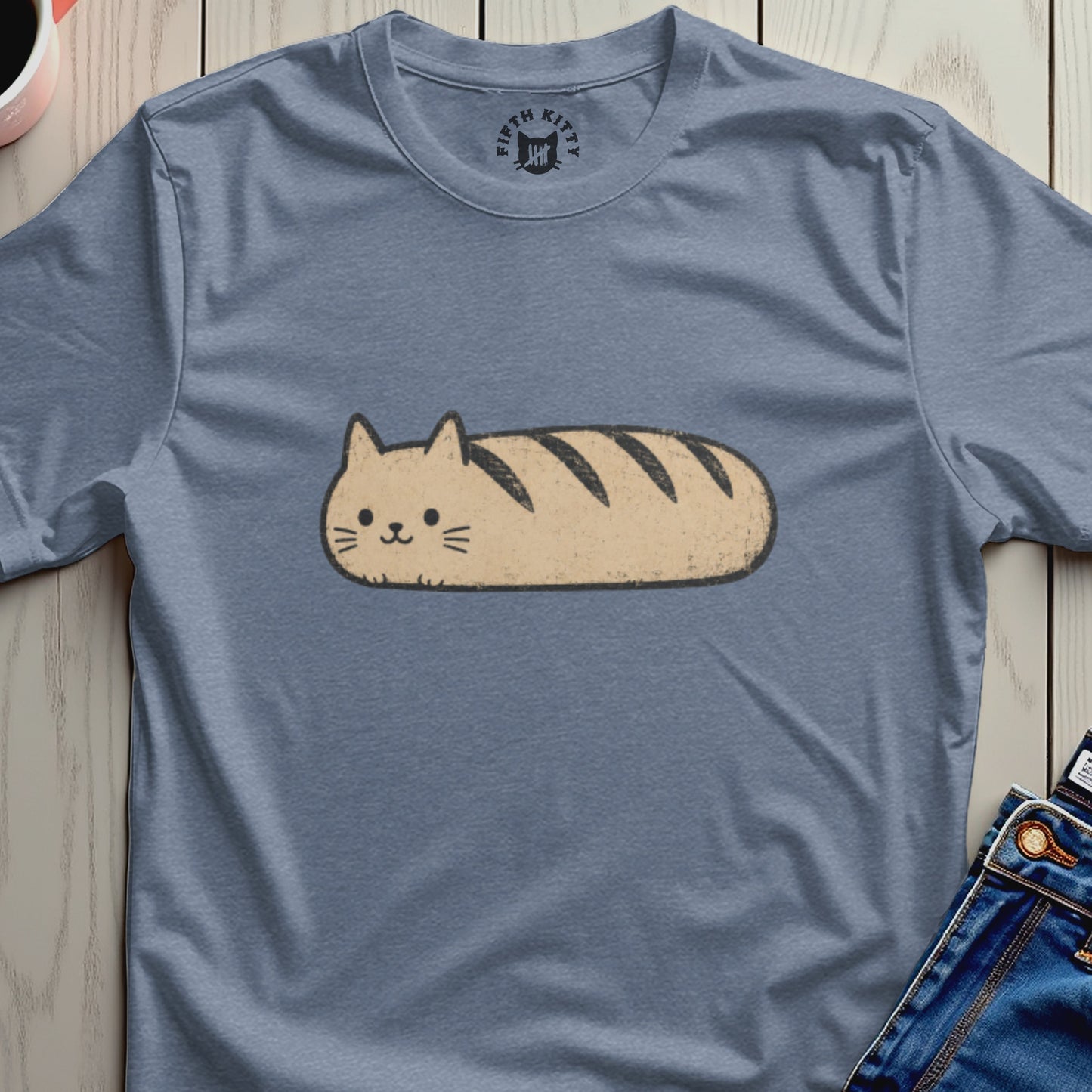T-shirt with a light brown cat loaf graphic and a vintage Fifth Kitty logo.