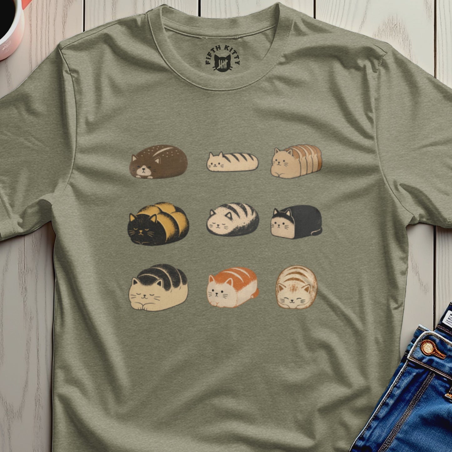 T-shirt with a repeating pattern of nine cute cat loaves in various colors.