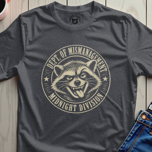 Dark grey t-shirt with raccoon graphic and "Dept. of Mismanagement Midnight Division" text.