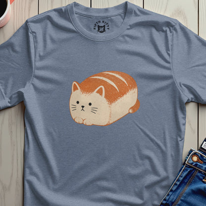 Cat made to look like a loaf of bread with orange stripes on a blue shirt.
