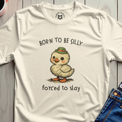 T-shirt with a cartoon chick wearing a hat, "BORN TO BE SILLY FORCED TO SLAY" text.