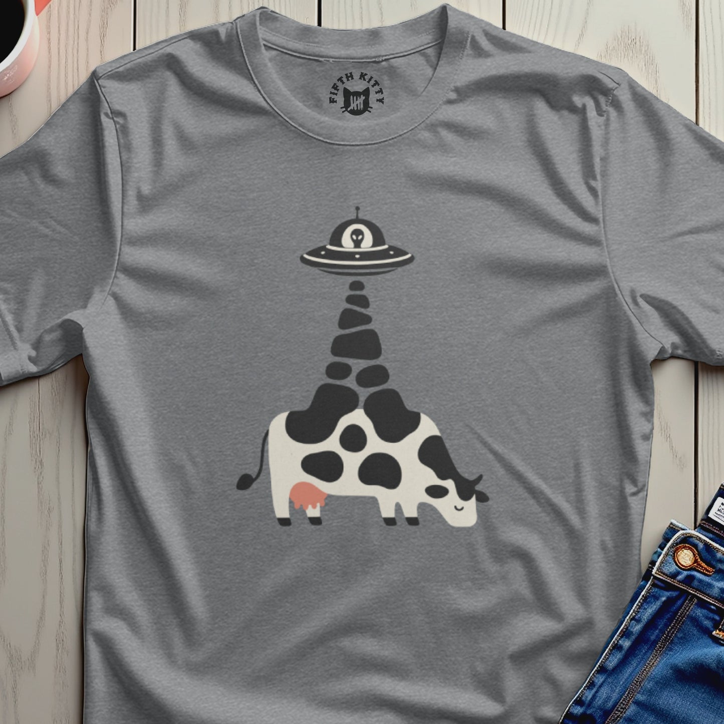 Gray t-shirt with a black graphic of a cow being abducted by a UFO.