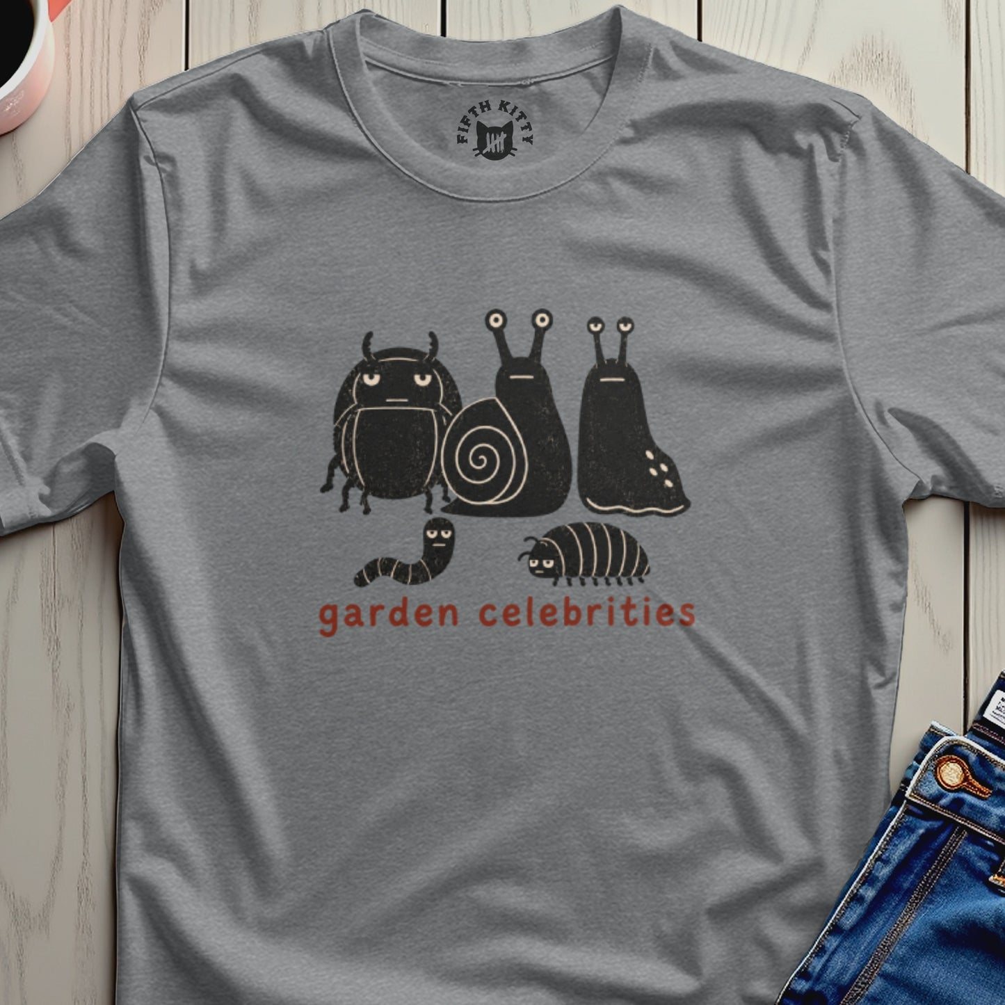 Grey t-shirt with black cartoon bugs and "garden celebrities" text.