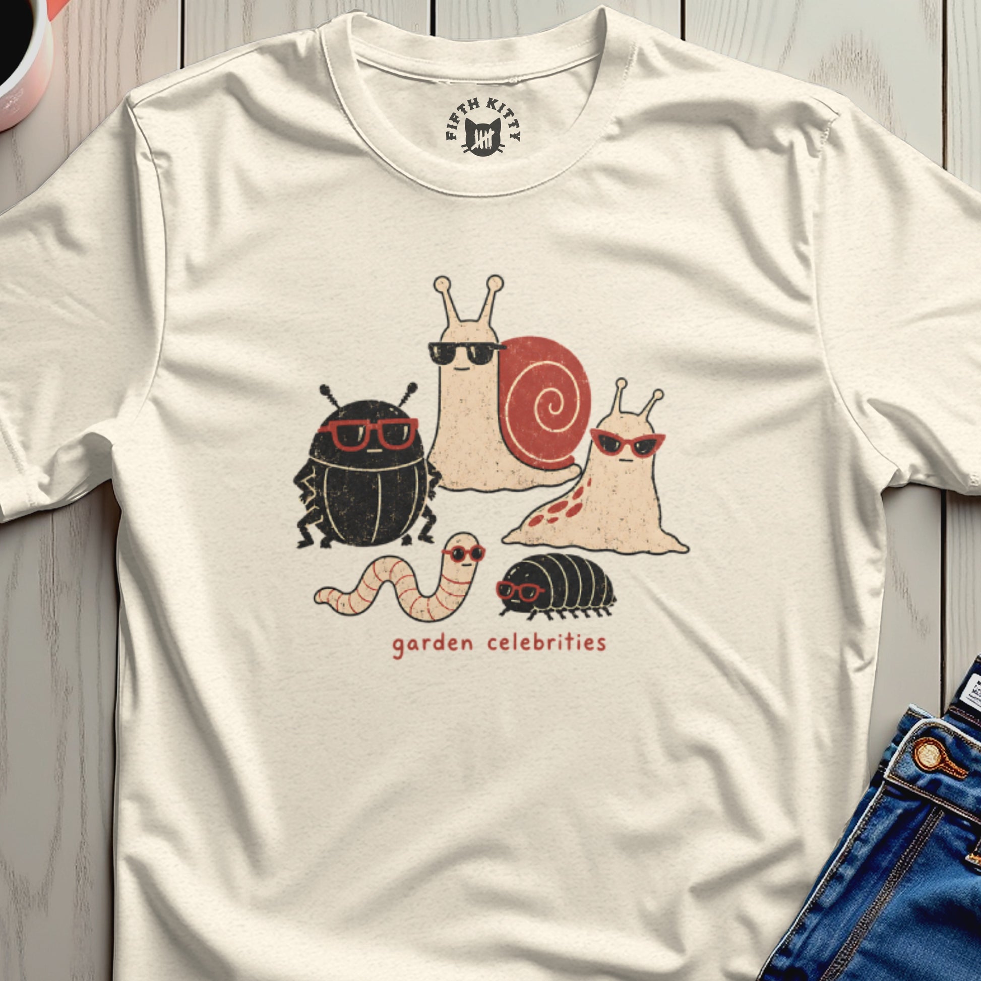 Cream t-shirt with screen-printed insects wearing sunglasses and the text "garden celebrities".