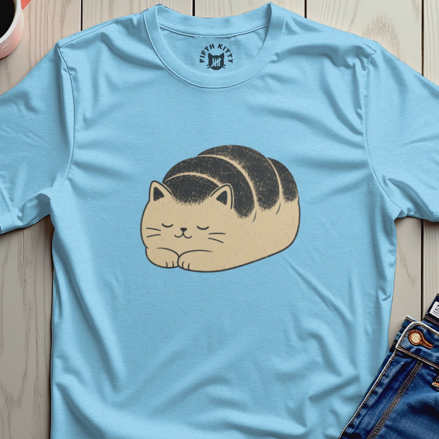 Light blue t-shirt with a cartoon cat loaf of bread graphic and "Fifth Kitty" logo.
