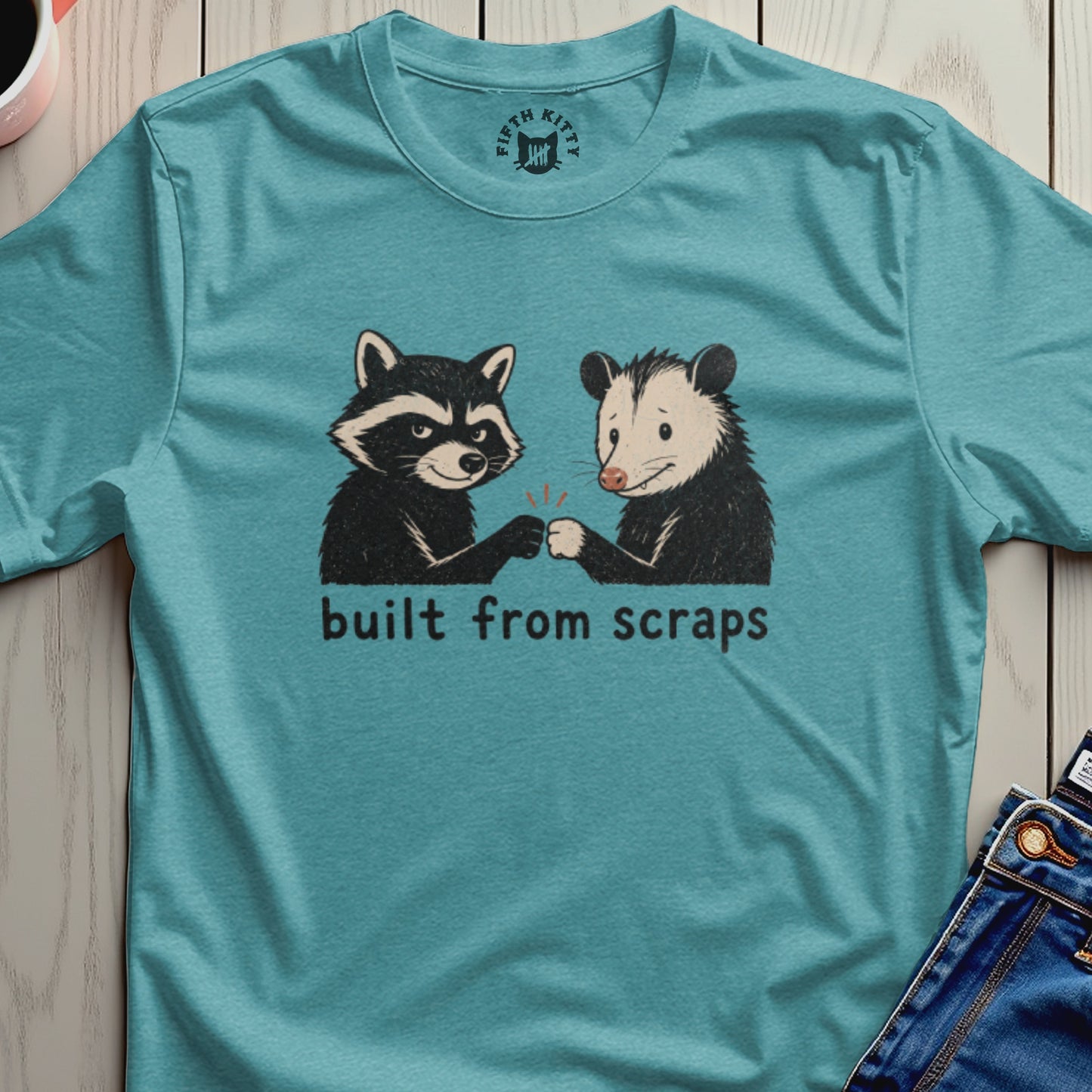 Raccoon and opossum fist bump with text "built from scraps" below.