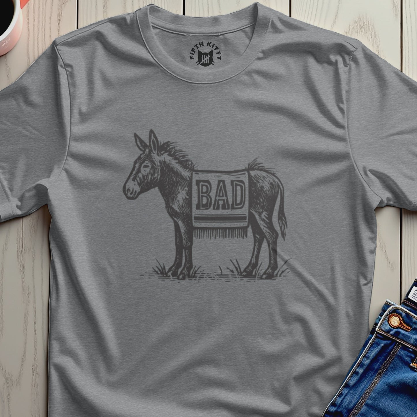 T-shirt with a vintage donkey illustration wearing a blanket with the word "BAD".