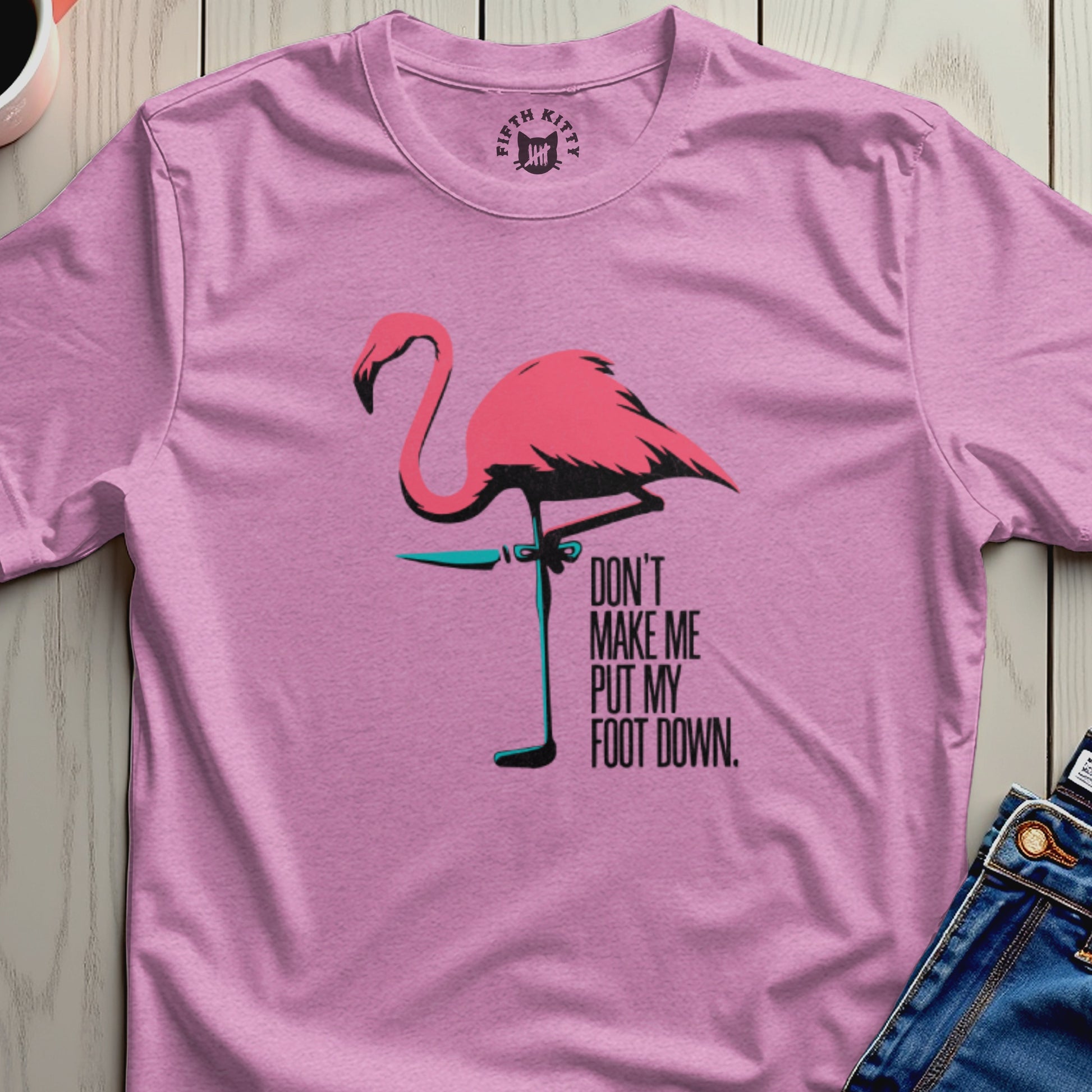 Pink t-shirt with flamingo graphic and text "DON'T MAKE ME PUT MY FOOT DOWN."