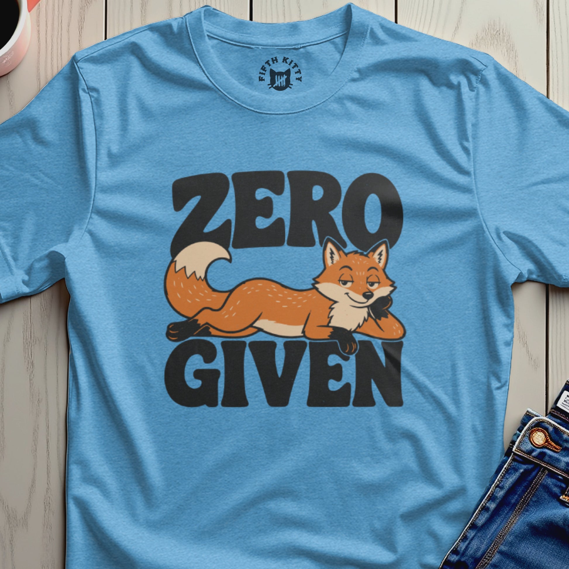 Blue t-shirt with a cartoon fox and "ZERO GIVEN" text.