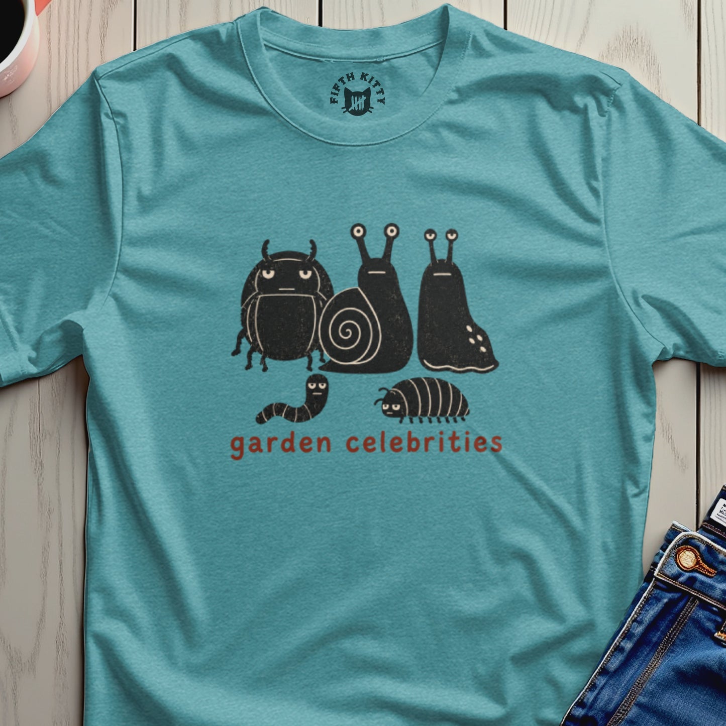 Teal t-shirt with graphic of stylized bugs and snails that reads "garden celebrities".
