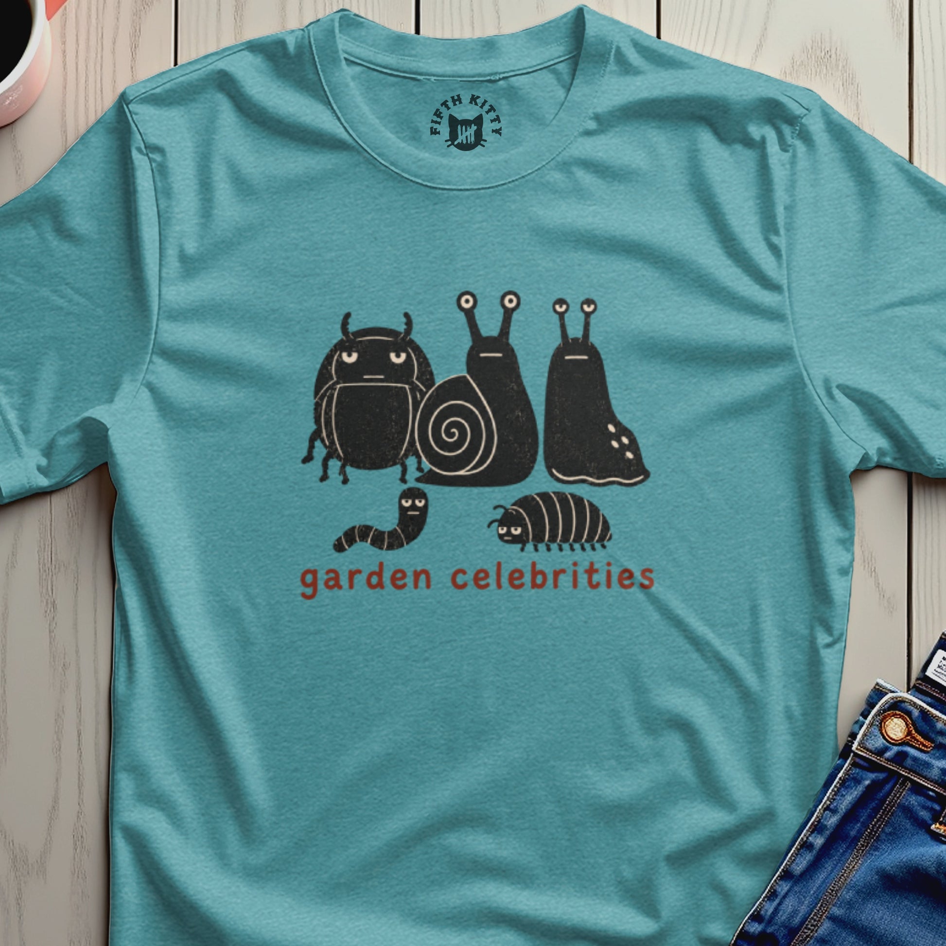 Teal t-shirt with graphic of stylized bugs and snails that reads "garden celebrities".