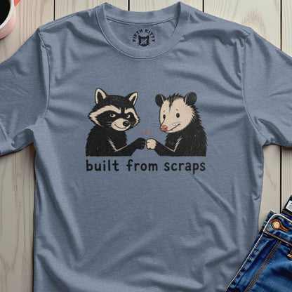Raccoon and opossum fist-bumping with text "built from scraps".