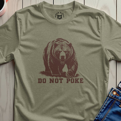 Bear graphic with "DO NOT POKE" text on a khaki t-shirt.