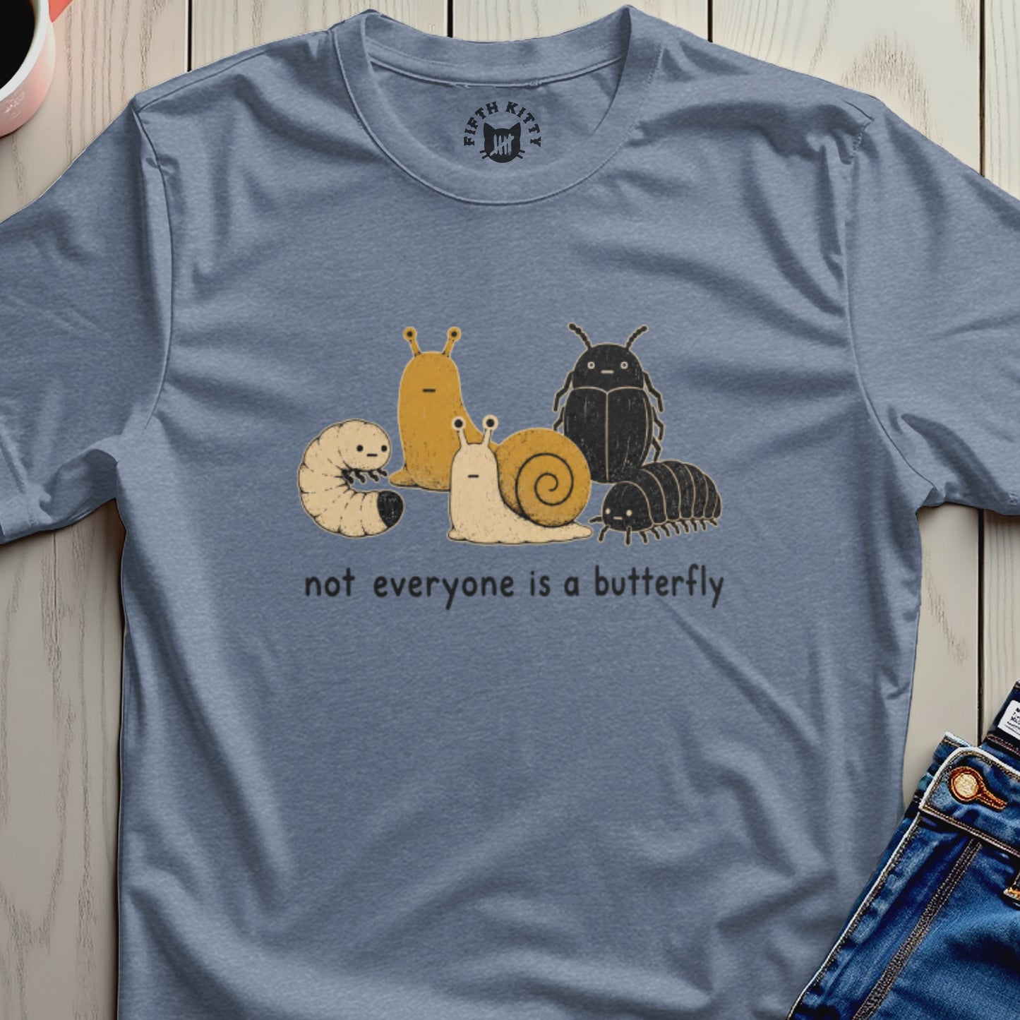 T-shirt with cartoon insects and text "not everyone is a butterfly".