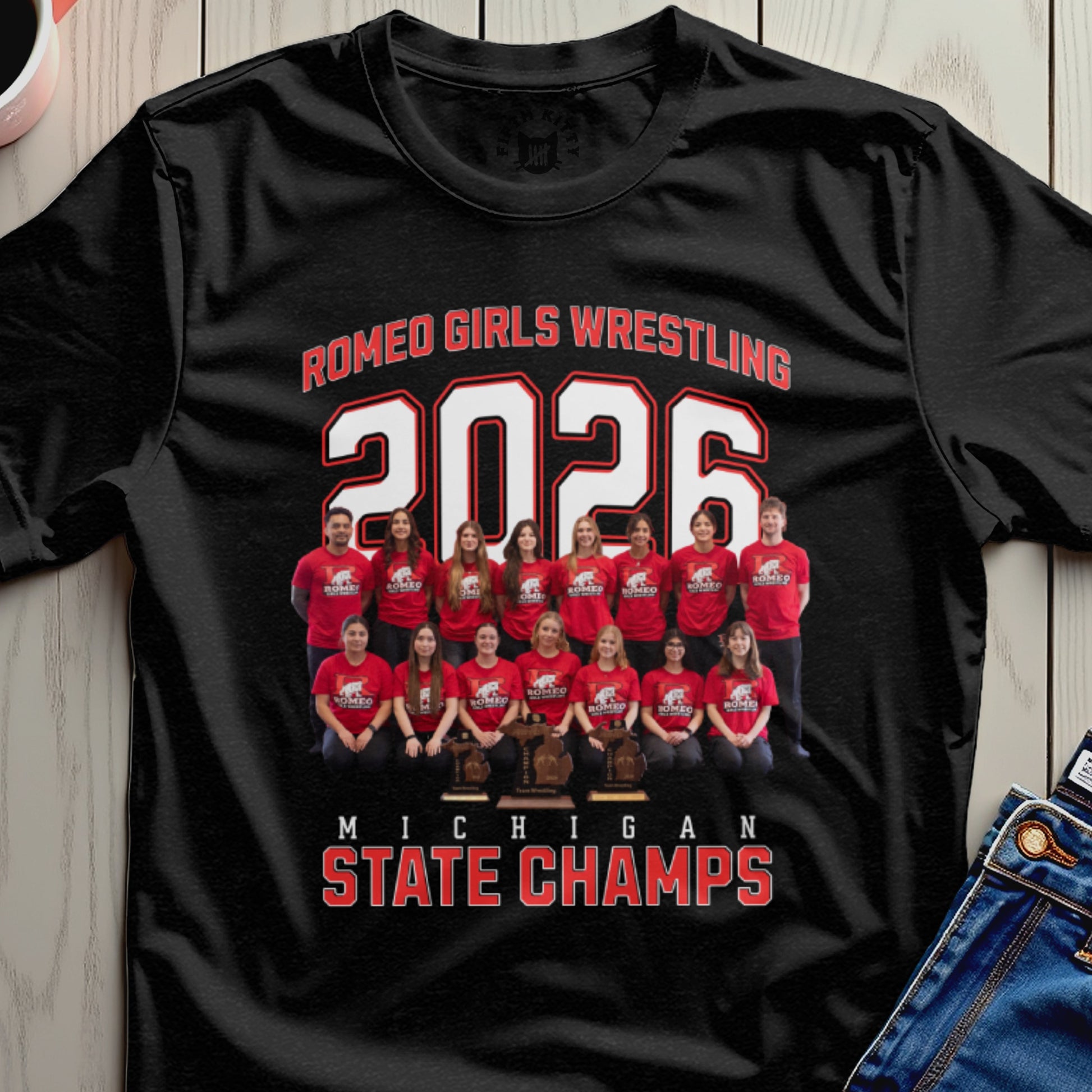 Romeo Girls Wrestling 2026 Michigan State Champs team photo on black t-shirt.