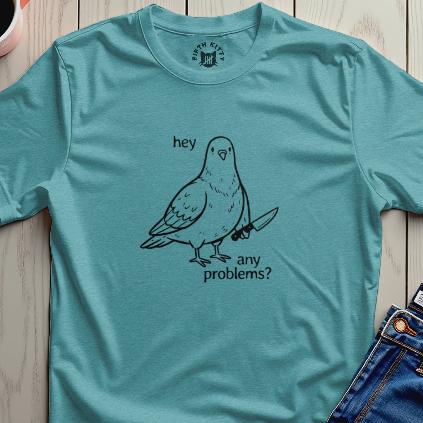 T-shirt with a pigeon holding a knife and text "hey any problems?".
