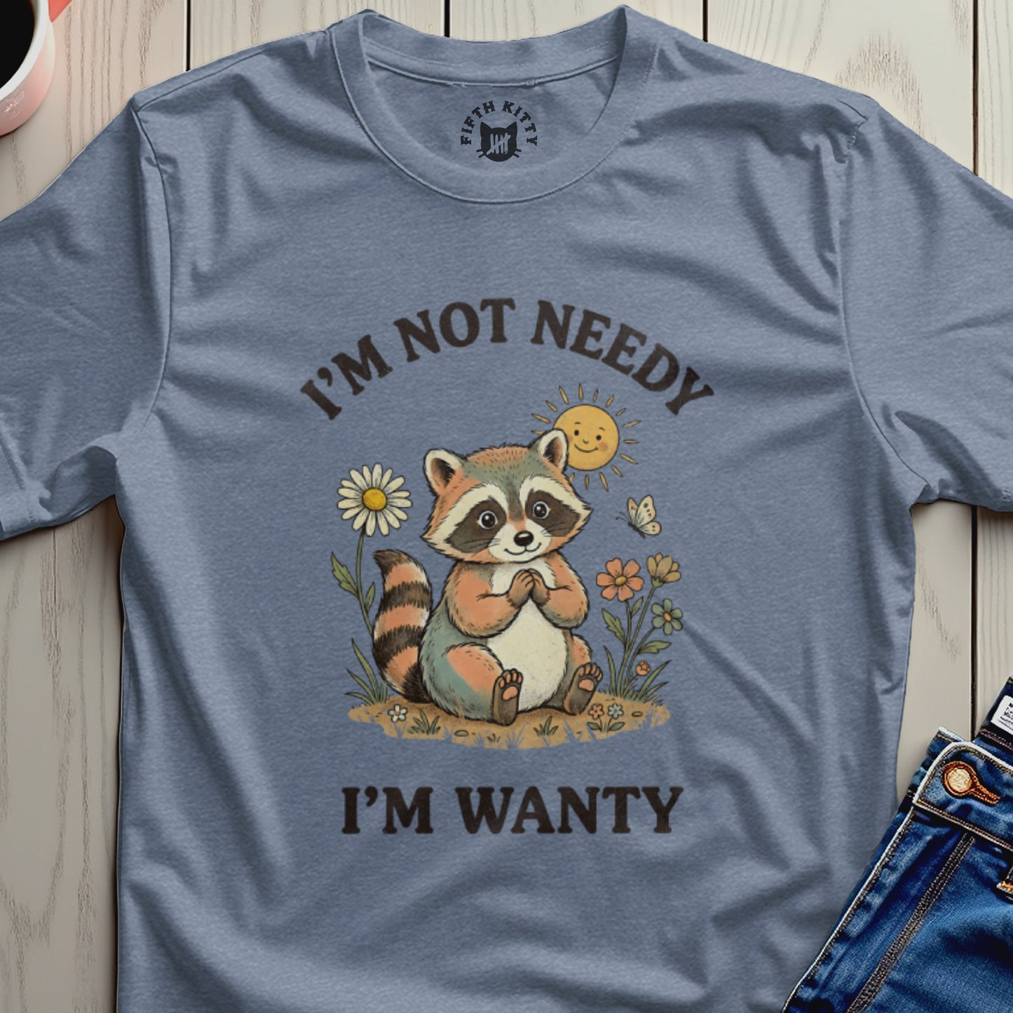 Raccoon with text "I'm Not Needy I'm Wanty" and smiling sun.
