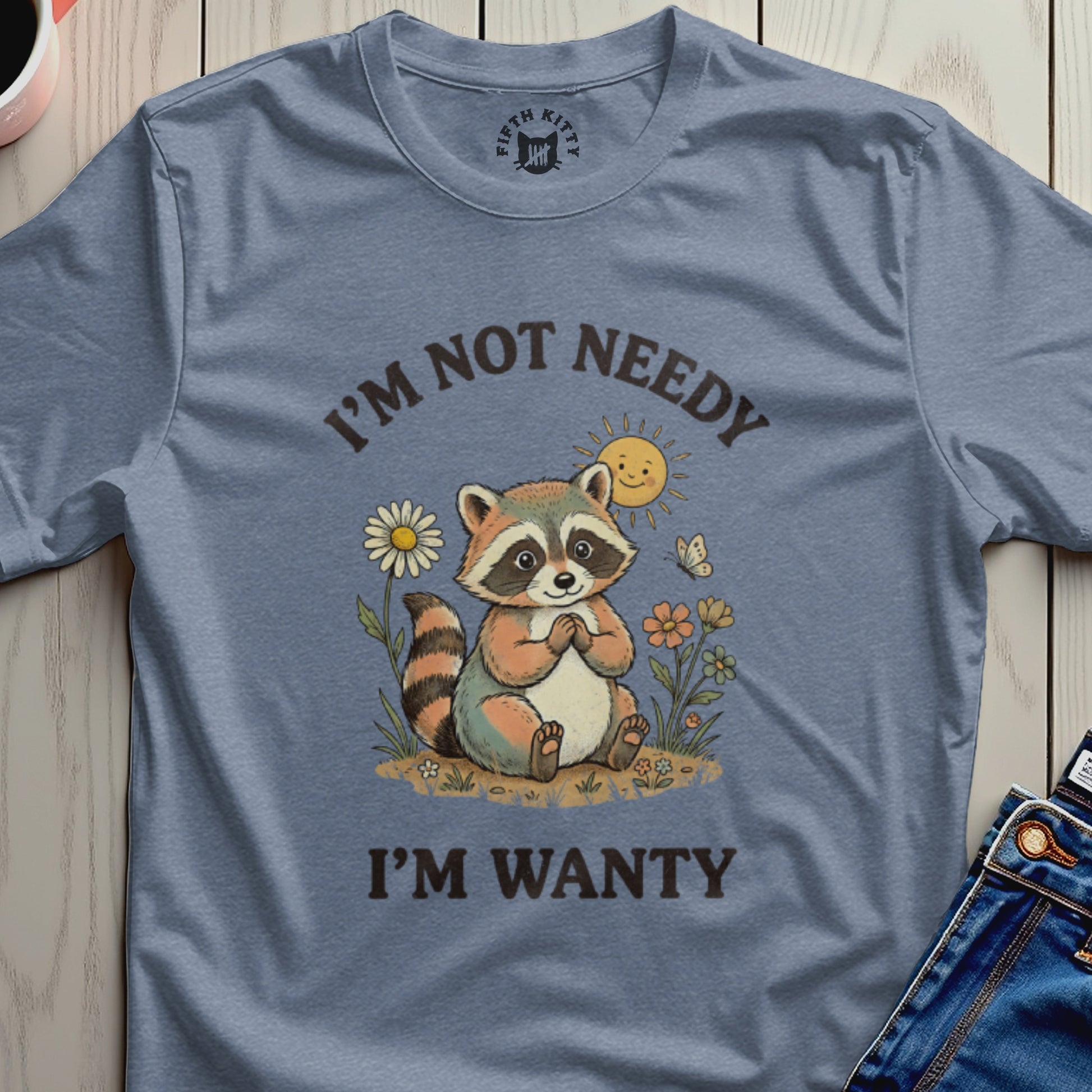Raccoon with text "I'm Not Needy I'm Wanty" and smiling sun.