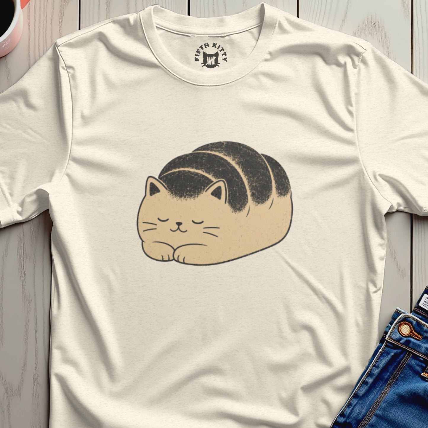 Light cream t-shirt featuring a loaf-shaped cat illustration and "FIFTH KITTY" logo on the collar.