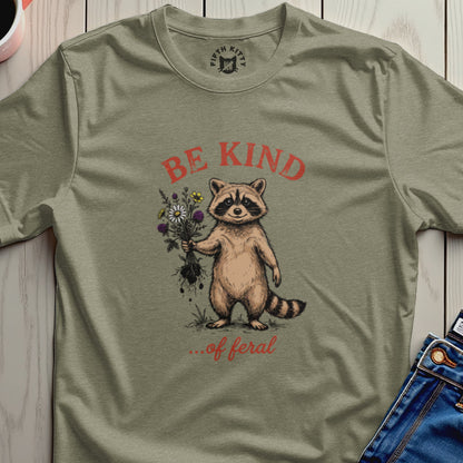 Raccoon holding flowers with "BE KIND ...of feral" text.