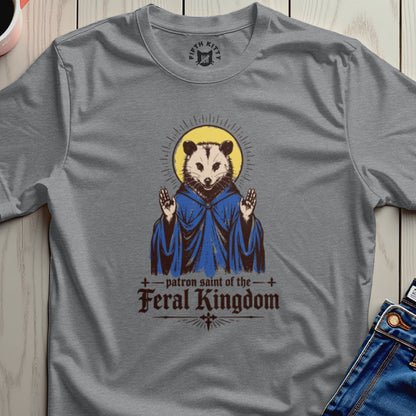 T-shirt graphic of a possum depicted as a saint, wearing a blue robe.