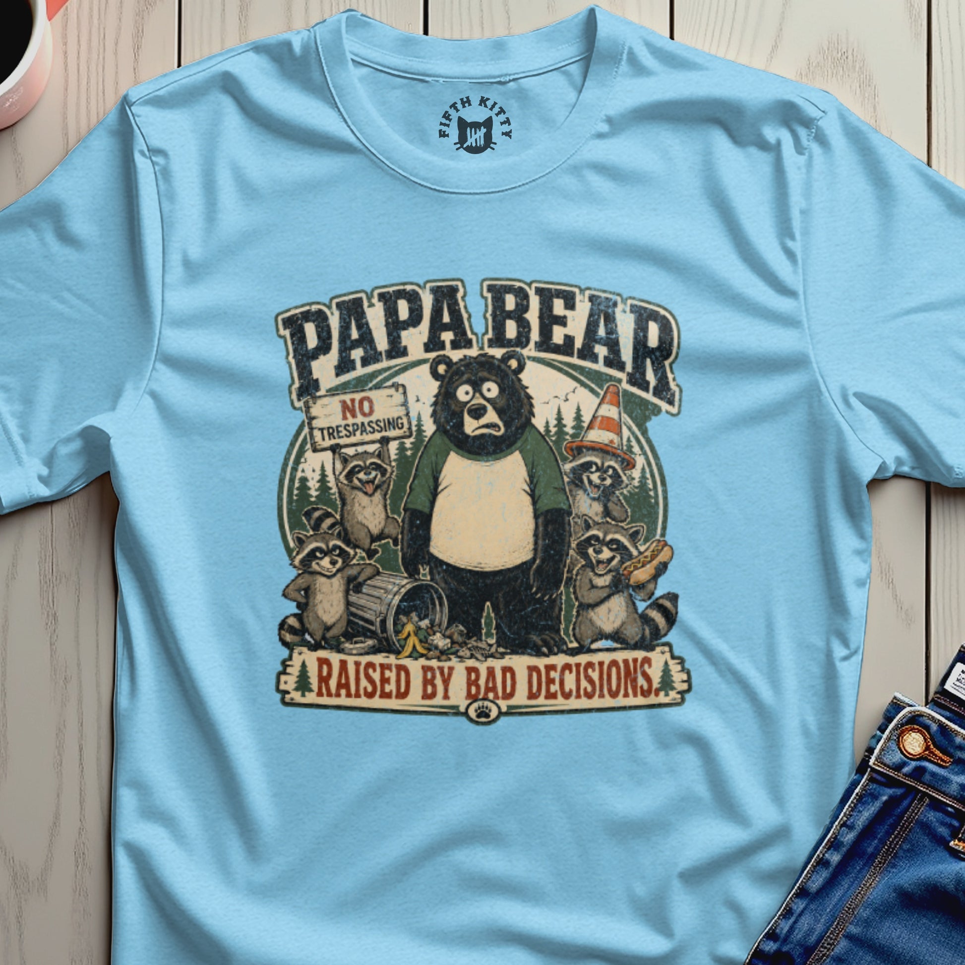 T-shirt graphic of a bear and raccoons on a "No Trespassing" sign with text "PAPABEAR RAISED BY BAD DECISIONS".