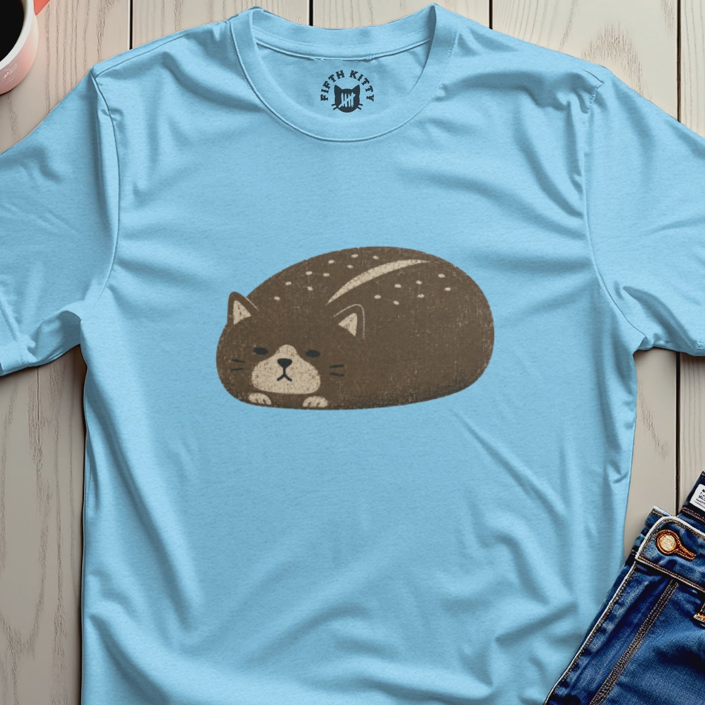 Light blue t-shirt with a distressed brown cat graphic and "Fifth Kitty" logo.