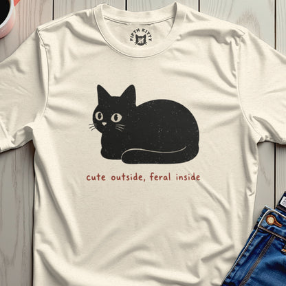Cream t-shirt with black cat graphic and text "cute outside, feral inside".