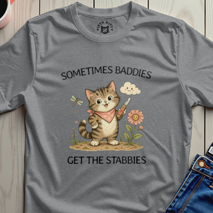 Cat with knife and flower, text "Sometimes baddies get the stabies".