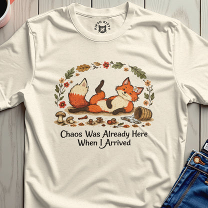Cream t-shirt with a graphic of a whimsical fox, mushrooms, and leaves with text.