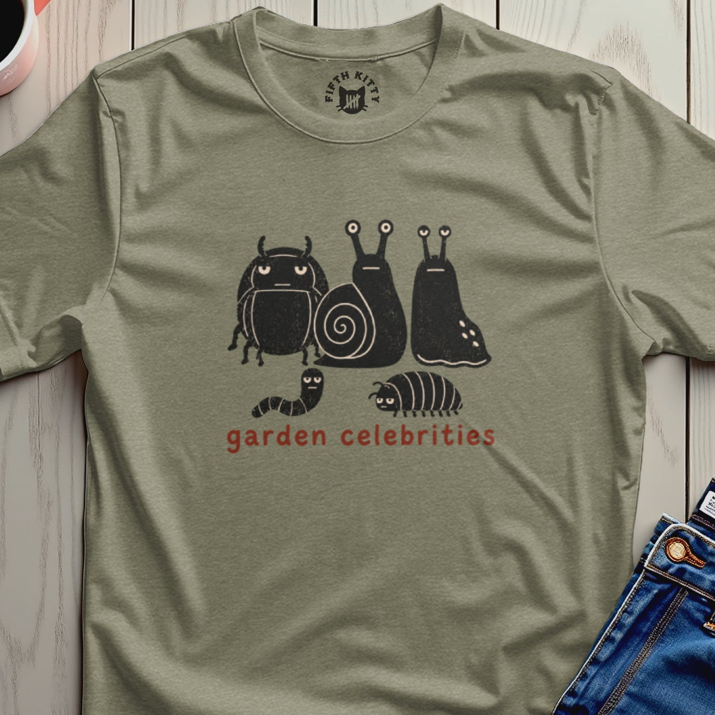 Olive t-shirt with cartoon bugs and snails, "garden celebrities" text.