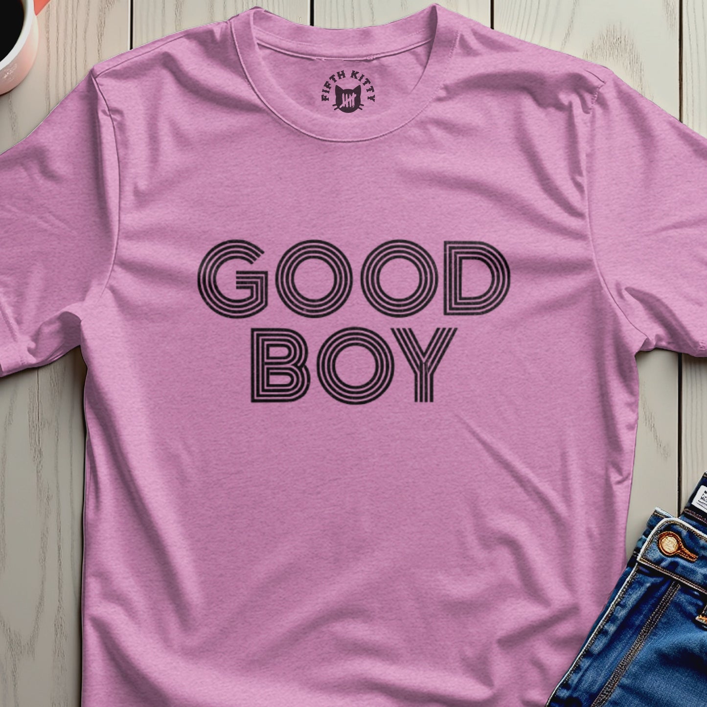 Pink t-shirt with "GOOD BOY" in black block letters.