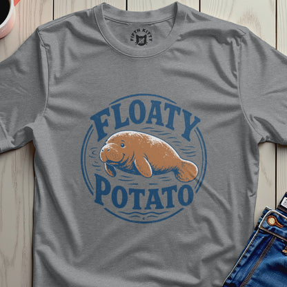 Manatee graphic with text "FLOATY POTATO" on a gray t-shirt.
