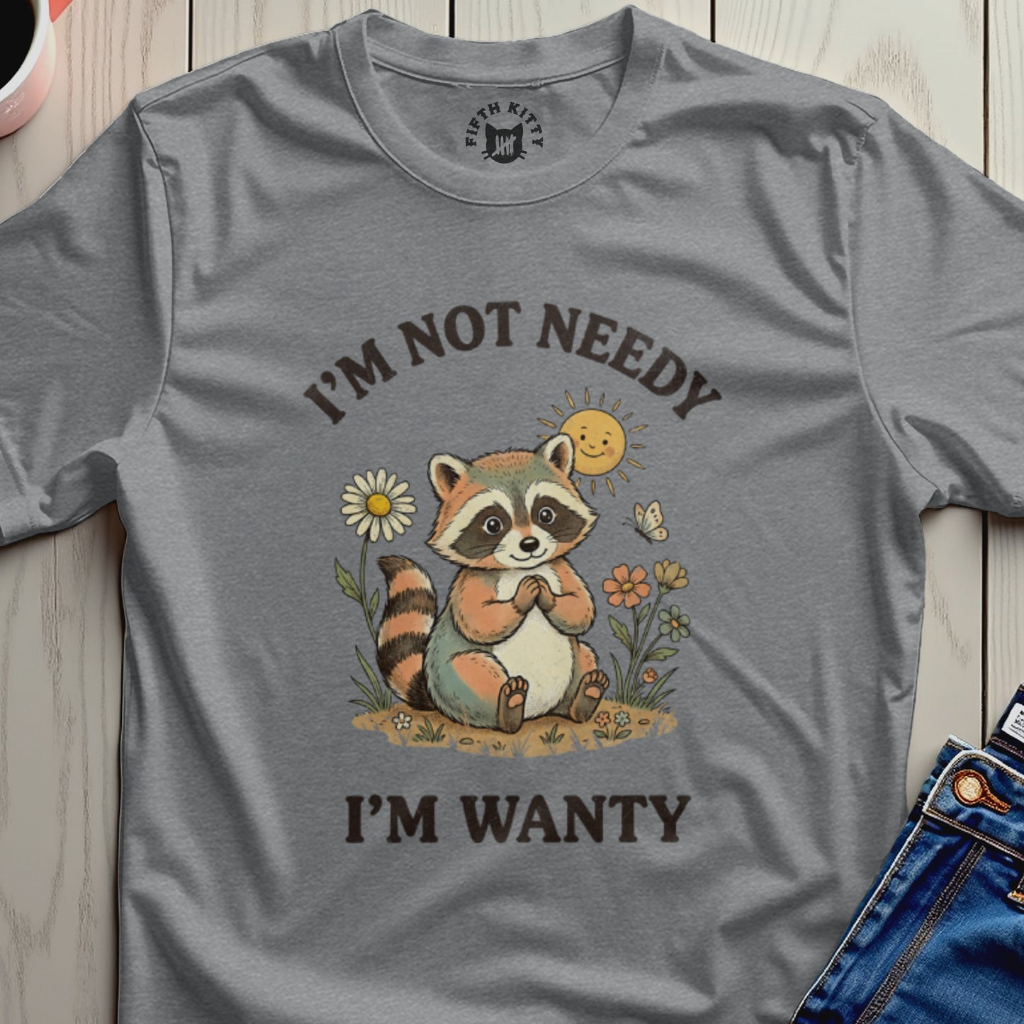 Gray t-shirt with a cartoon raccoon and the text "I'M NOT NEEDY I'M WANTY".