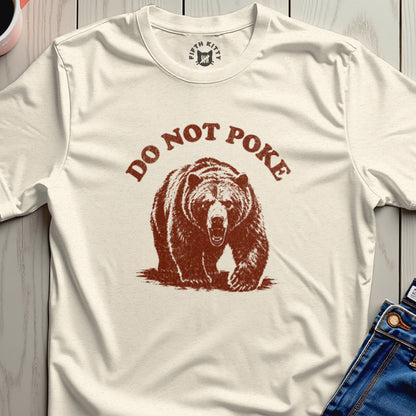 Cream t-shirt with distressed brown bear graphic and text "DO NOT POKE".